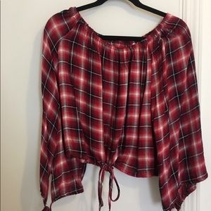 Off the shoulder, cropped flannel blouse.